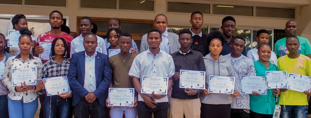 Graduates of an SNG1 mental health programme holding certificates
