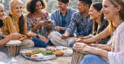 Group sharing food and music